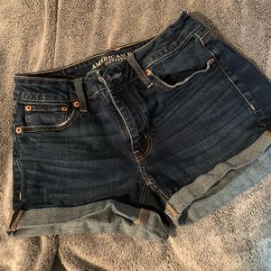American Eagle “Tom Girl Midi” stretch jean shorts